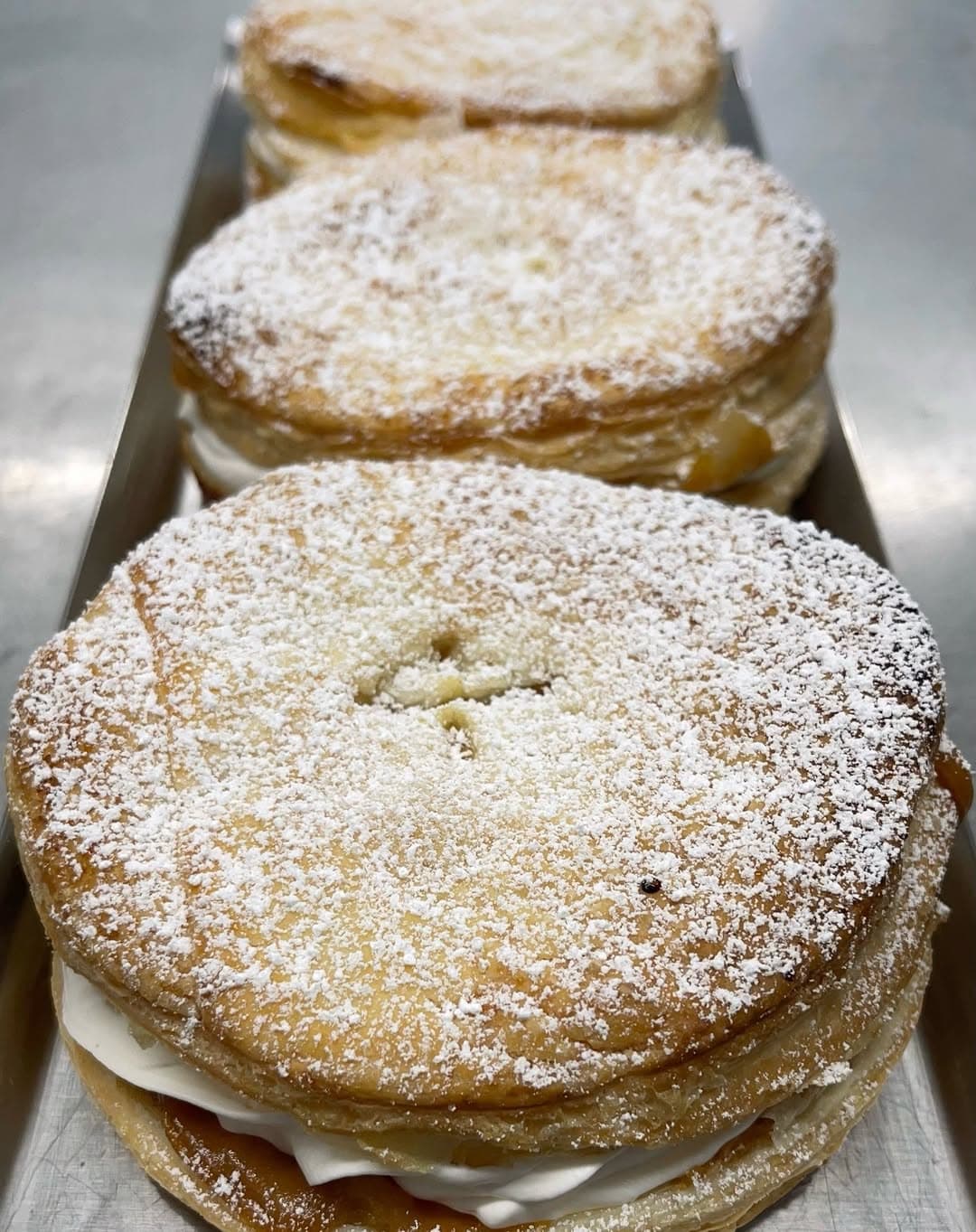 A tray of cream tarts ready for the cabinet